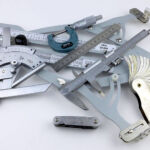 A set of gauges and precision measuring equipment including a Vernier protractor, callipers, fixed radius gauges and the Arc Master adjustable radius gauge.