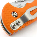 On the clip side of the pivot bolt, the nut is flush and uses a 'security' style two-slot design.