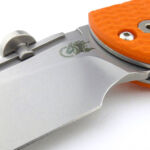 A wide finger/sharpening/safety choil spans the smooth plunge line.