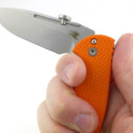 The large choil provides a degree of safety if the blade closes by mistake. It brings the cutting edge away from the finger as shown in the half-open position.