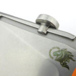 The channel on each side of the blade forms a T-shaped section that the thumb disc slides onto.