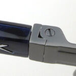 The Hinge is sprung so can flex outward as well.