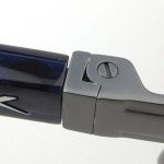 The Hinge is sprung so can flex outward as well.