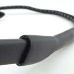 The rubber tube of the neck strap is pushed over the end of the arm.