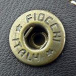 Fiocchi press-studs are used (I believe Fiocchi have stopped making these now).