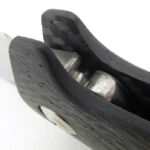 A deep finger guard is integrated into the handle.