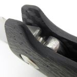 A deep finger guard is integrated into the handle.