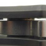 Looking into the knife you can see the detent ball engaged in the blade tang. Also note the washer.