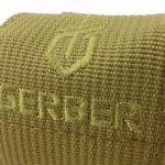 The pouch has an embroidered logo.