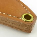 The sheath is a quality to match the knife. Riveted for strength and for lanyard attachment.