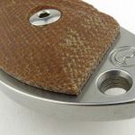 The lanyard hole and striker pommel.