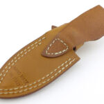 The belt loop is formed from the same piece of leather as the sheath back.