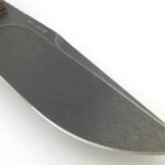 The blade is almost a full flat grind and has a long swedge.