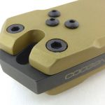 The spacer extends to form a striker.