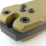 The spacer extends to form a striker.