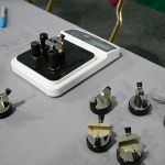 An Edge On Up Tester with multiple test fixtures.