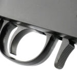 Forward of the trigger guard is the action opening lever.