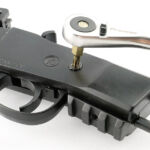 A screw on each side needs to be loosened.