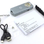Included in the box are the instructions, a USB cable, pocket clip, and lanyard cord.