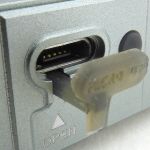 The port cover pulls out.