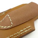 Folded and sewn into a loop.