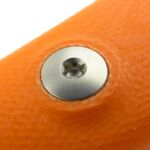 One of the two bolts holding the handle in place.