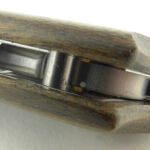 Looking inside, the stop pin and washers are visible.