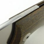 As in a friction folder, the tang is used to secure the blade during use.