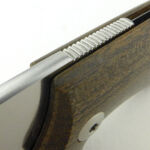 As in a friction folder, the tang is used to secure the blade during use.