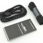 Also included are a neck strap and cleaning cloth.