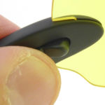 Start by gripping the arm lock.