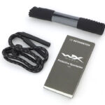 A neck strap and cleaning cloth are standard.