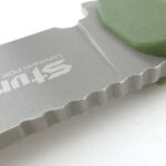 Wavy jimping for added thumb grip.