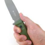Thumb forward grip.