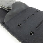 Visible through the fabric are a couple of eye-rivets through the kydex liner.