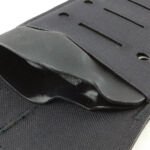 The shaped lips of the kydex liner hold the knife in place.