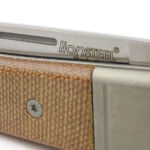 A rounded groove forms the nail-nick for opening.